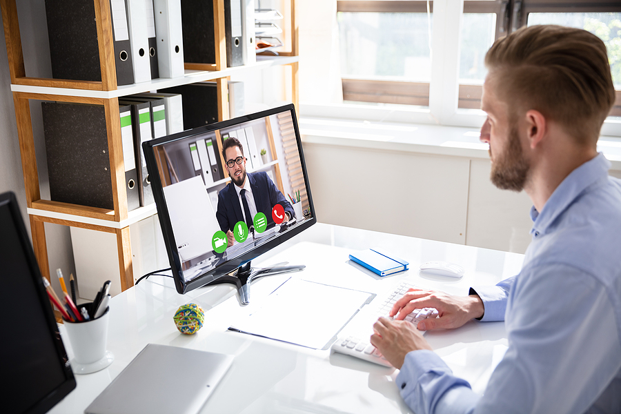 Businessman trying out video conferencing solutions in Melbourne