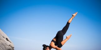 Professional online yoga teacher doing a pose